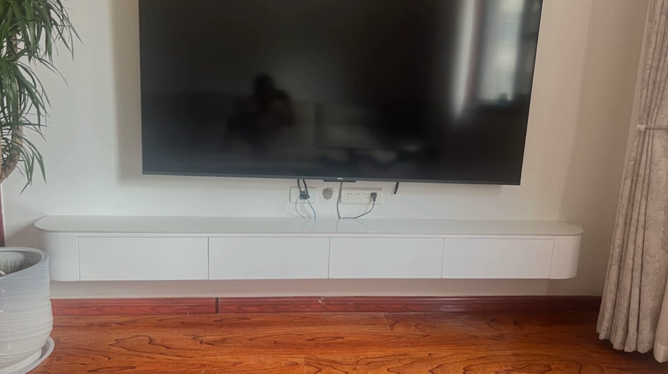 Customer photo review of Contemporary White Wall-Mounted TV Stand with Cabinet
