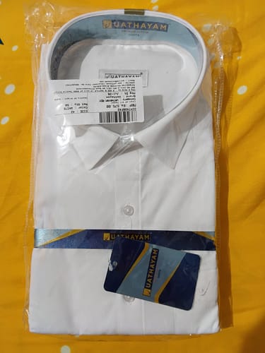 Customer's Double Delight White Shirt folded neatly inside clear protective plastic packaging.