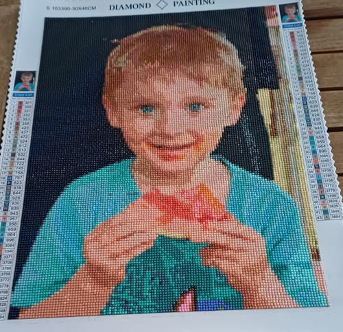 Customer's completed Diamond Painting eigenes Bild showing a smiling child portrait with vibrant colors