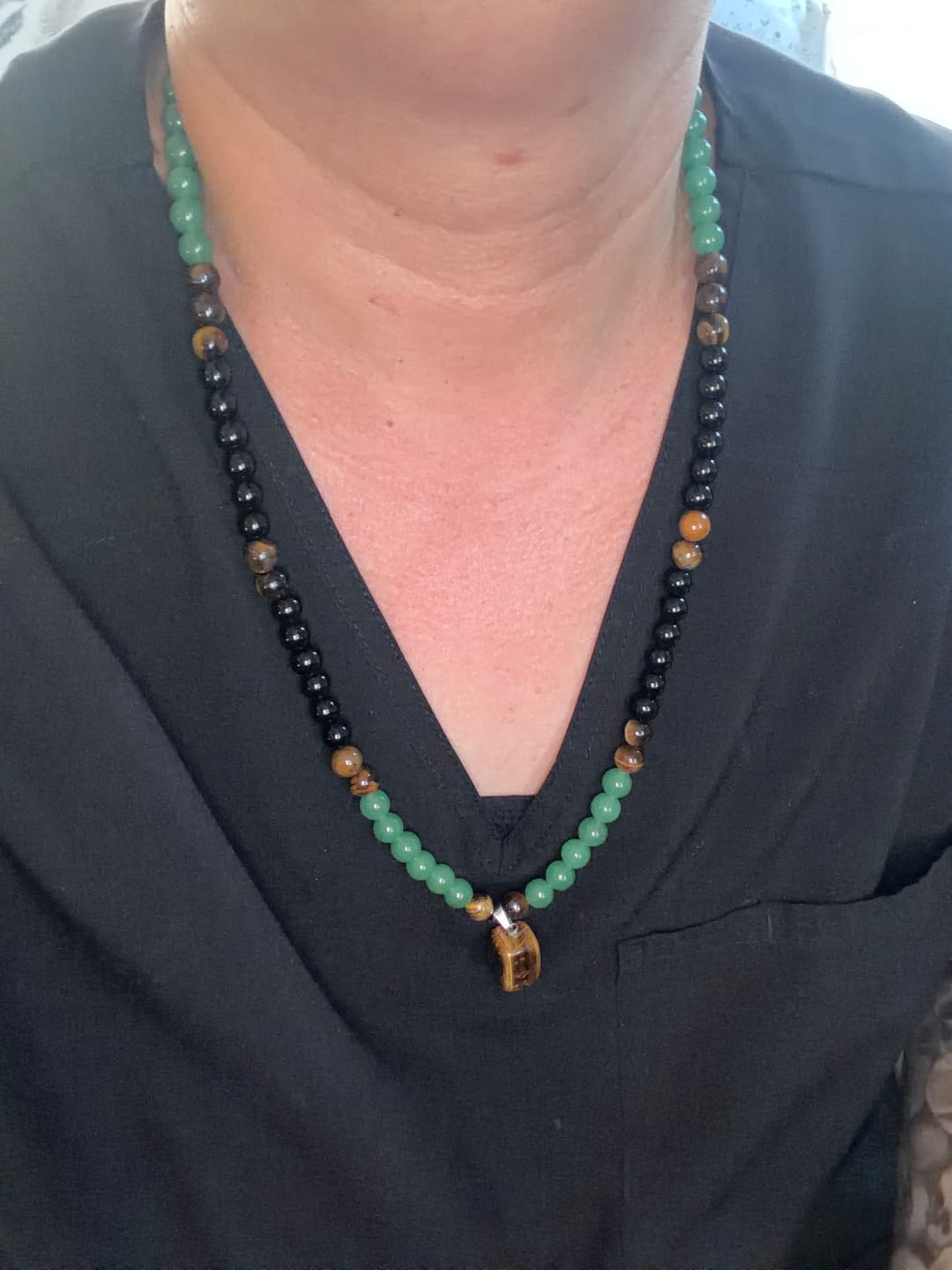 Customer photo review of ✨ Money Attraction Necklace With GreenAventurine & Tiger Eye Pendant Healing Crystal Stone
