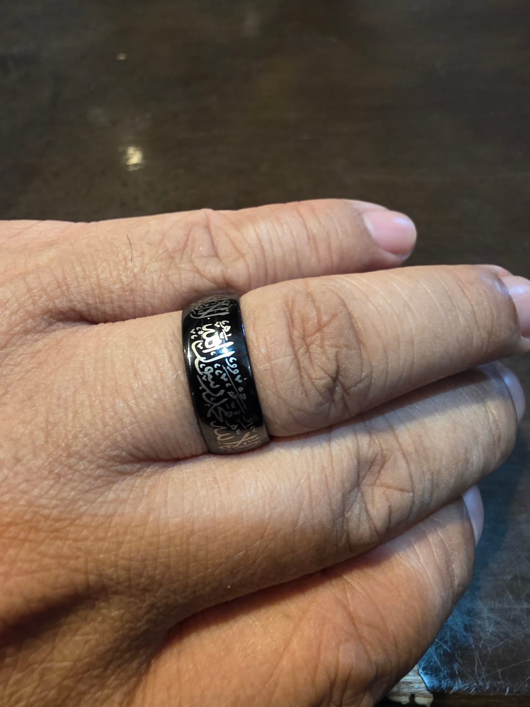 Customer photo review of HilalHaven Creed of Light Shahada Engraved Band Ring — Polished Stainless Steel
