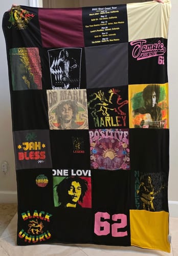 Reviewer's Project Repat T-Shirt Quilt featuring numerous Reggae-themed t-shirt graphics arranged in a grid.