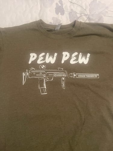Customer's green Pew Pew Tactical T-Shirt featuring a white graphic of a rifle with the words Pew Pew.