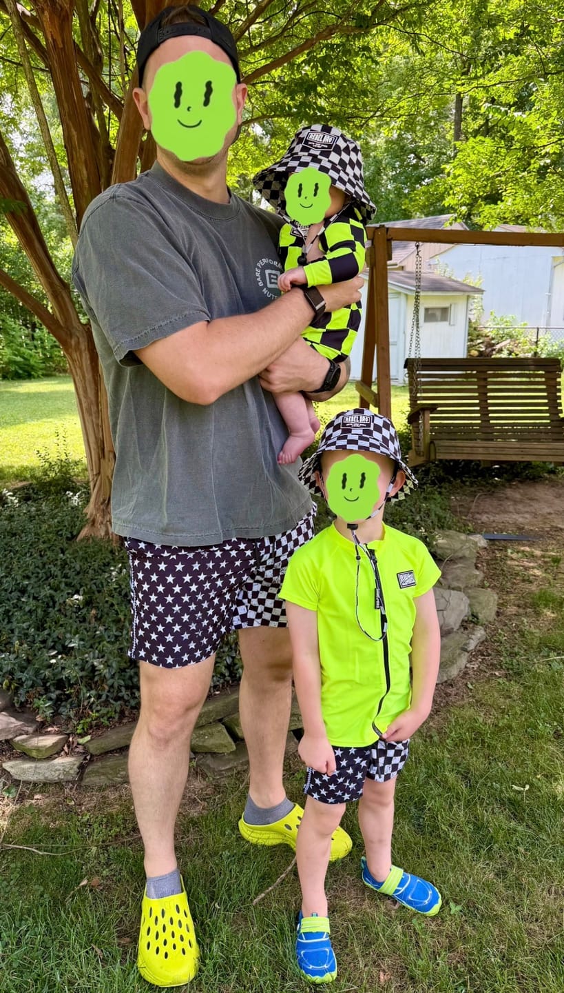 Customer photo review of UPF50+ Boys Swim Romper in Neon Electric Lime + Black Checkered