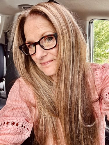 Reviewer selfie showing her smooth, glowing skin after using The Micro Infusion System.