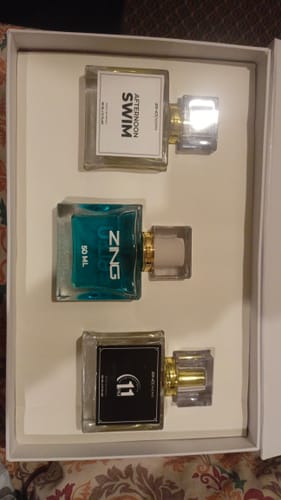 Customer's OUD Supreme BUNDLE showing three different perfume bottles nestled in a white presentation box.