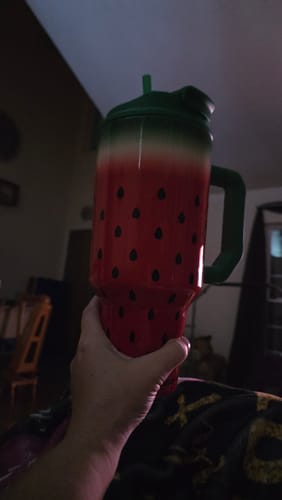Customer's Thicc Buddy cup in a watermelon pattern held in a hand