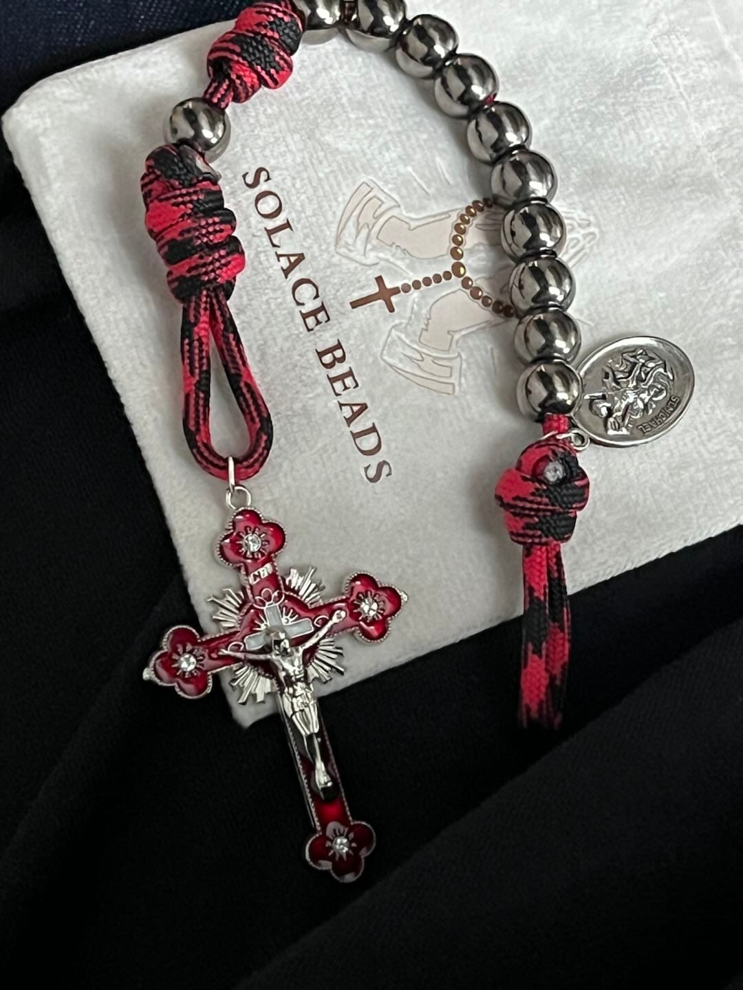 Customer photo review of Solacebeads Gunmetal Bead Car Rosary & Red Enamel Crucifix: Rooted In St. Michael Protection