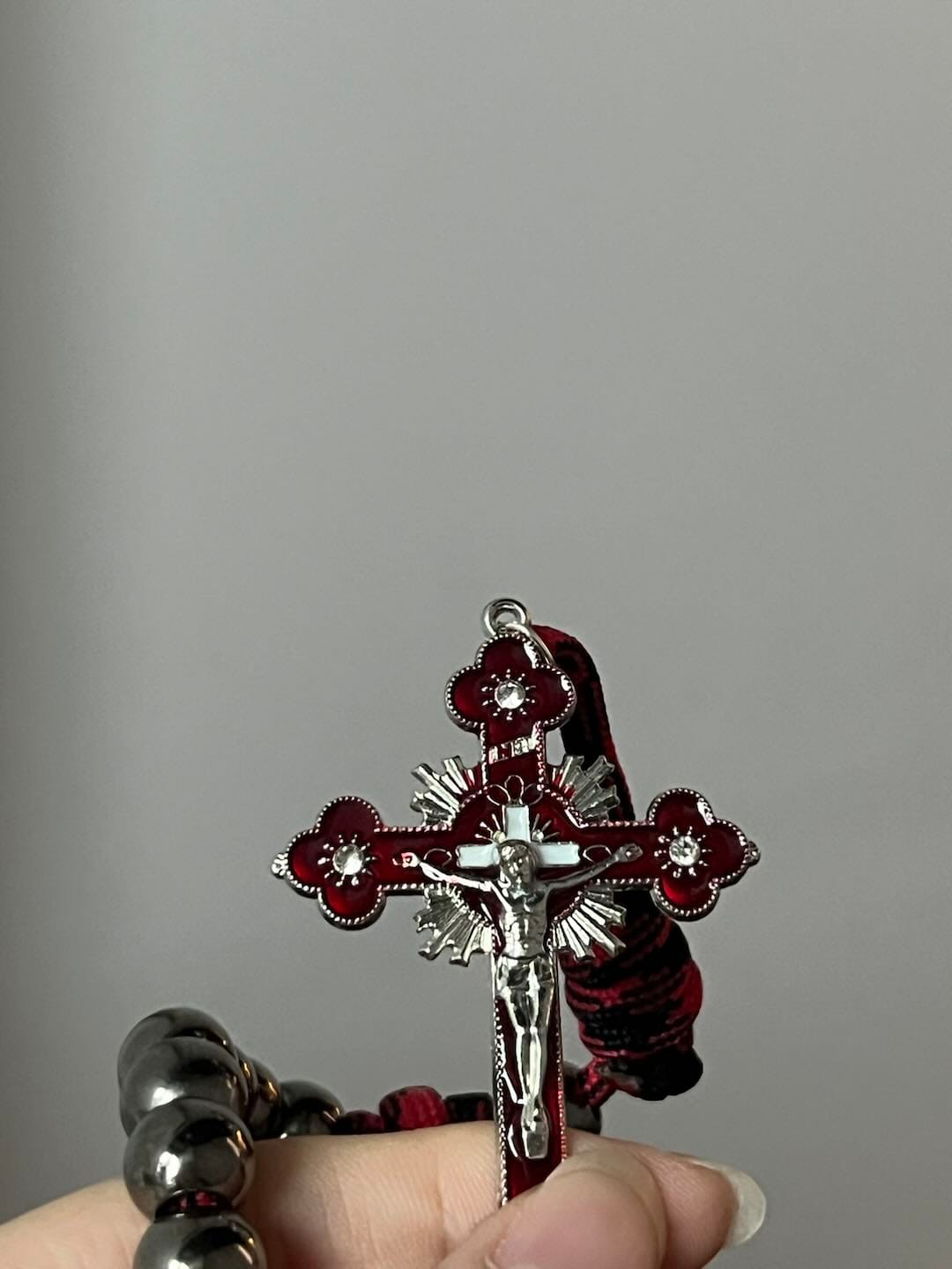 Customer photo review of Solacebeads Gunmetal Bead Car Rosary & Red Enamel Crucifix: Rooted In St. Michael Protection