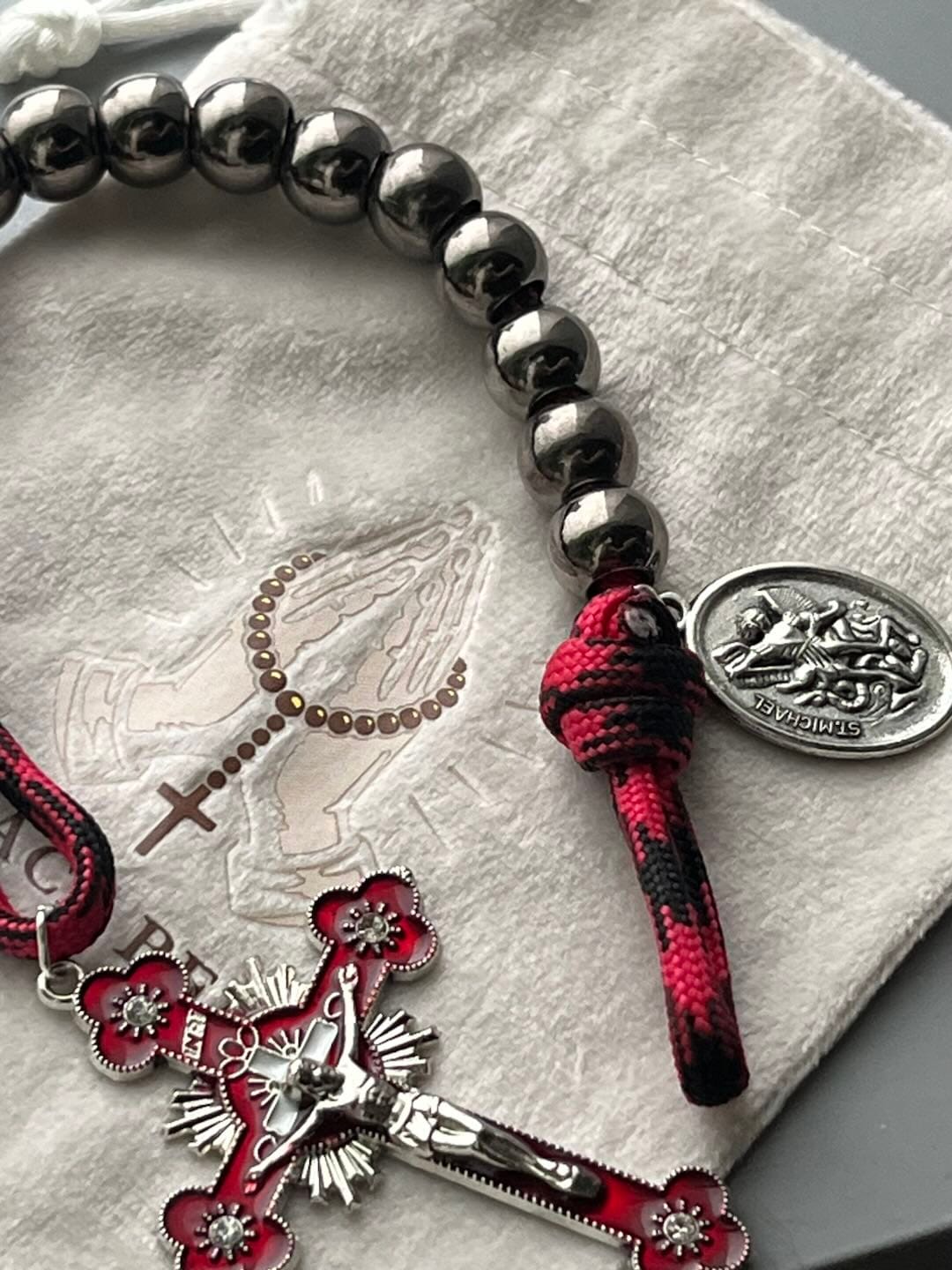 Customer photo review of Solacebeads Gunmetal Bead Car Rosary & Red Enamel Crucifix: Rooted In St. Michael Protection