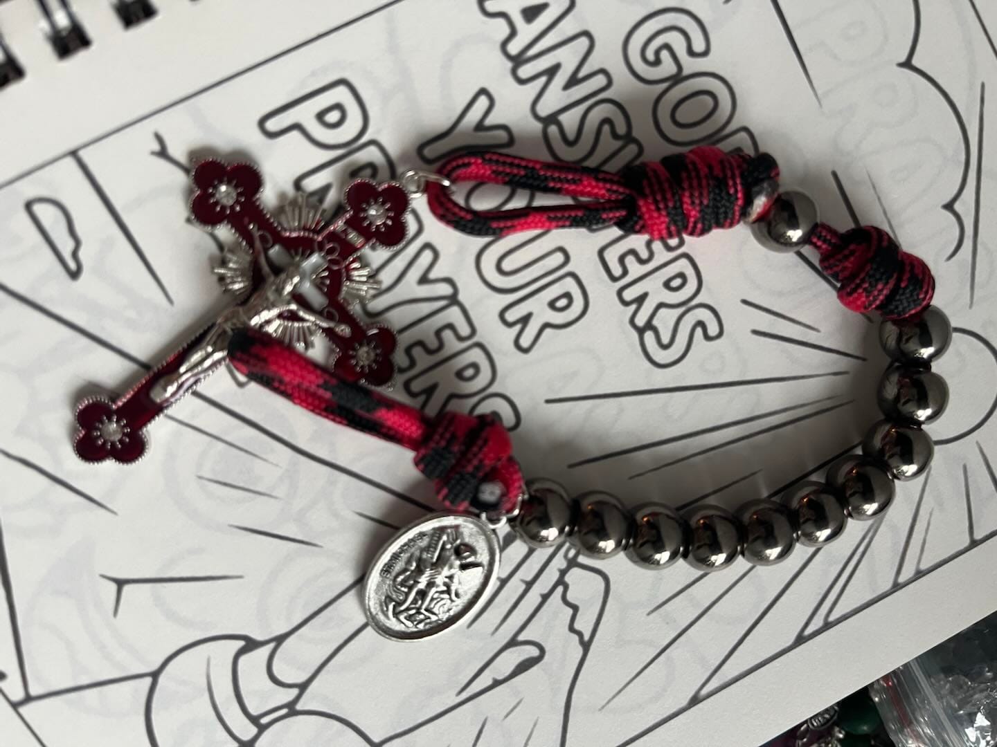 Customer photo review of Solacebeads Gunmetal Bead Car Rosary & Red Enamel Crucifix: Rooted In St. Michael Protection
