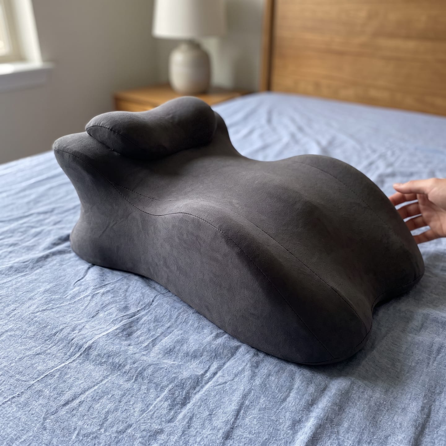 Customer photo review of The Pillow That Makes Her Grip The Sheets