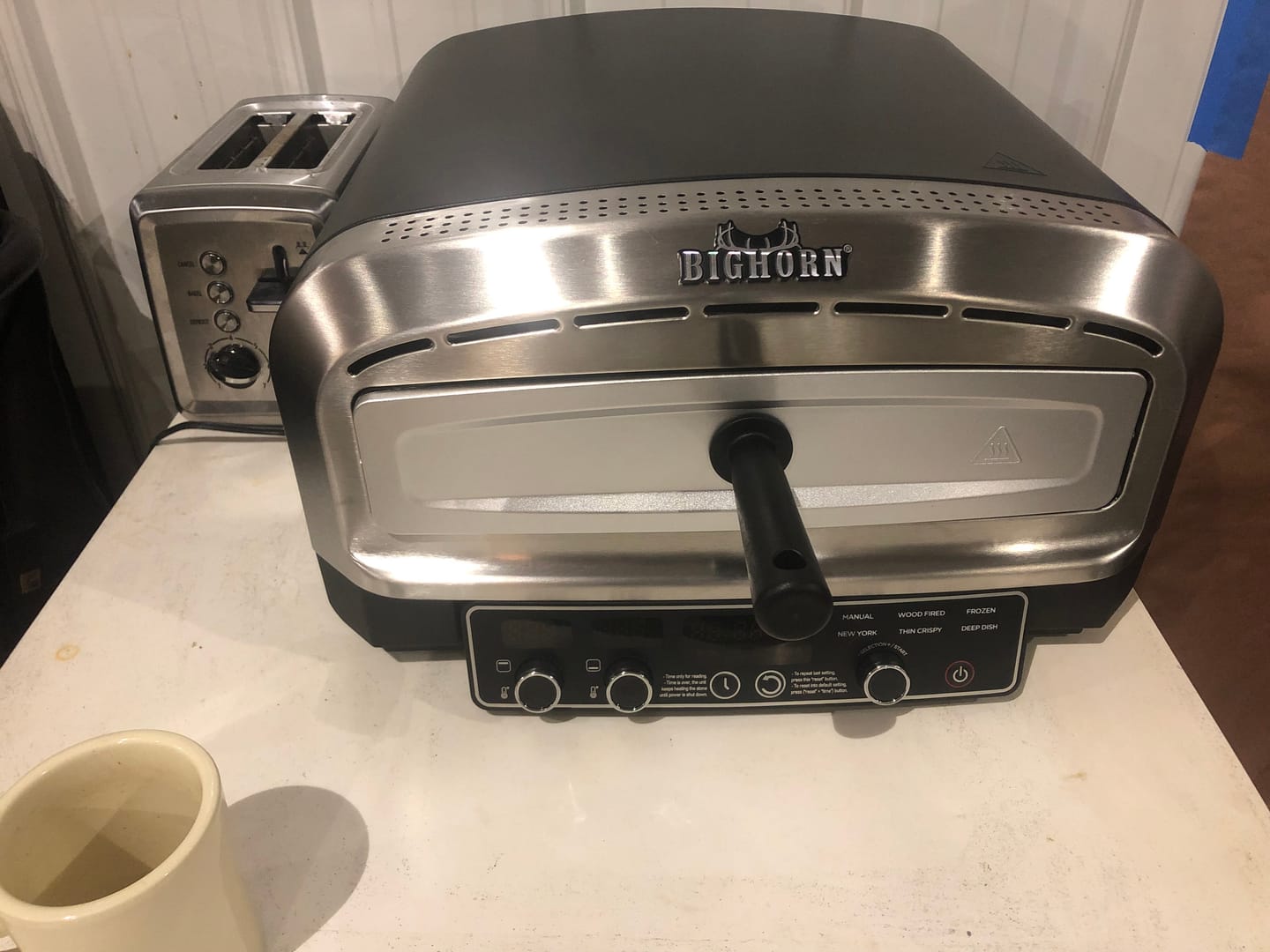 Customer photo review of 14" Indoor Electric Countertop Pizza Oven with 6 Preset Modes, Stainless Steel