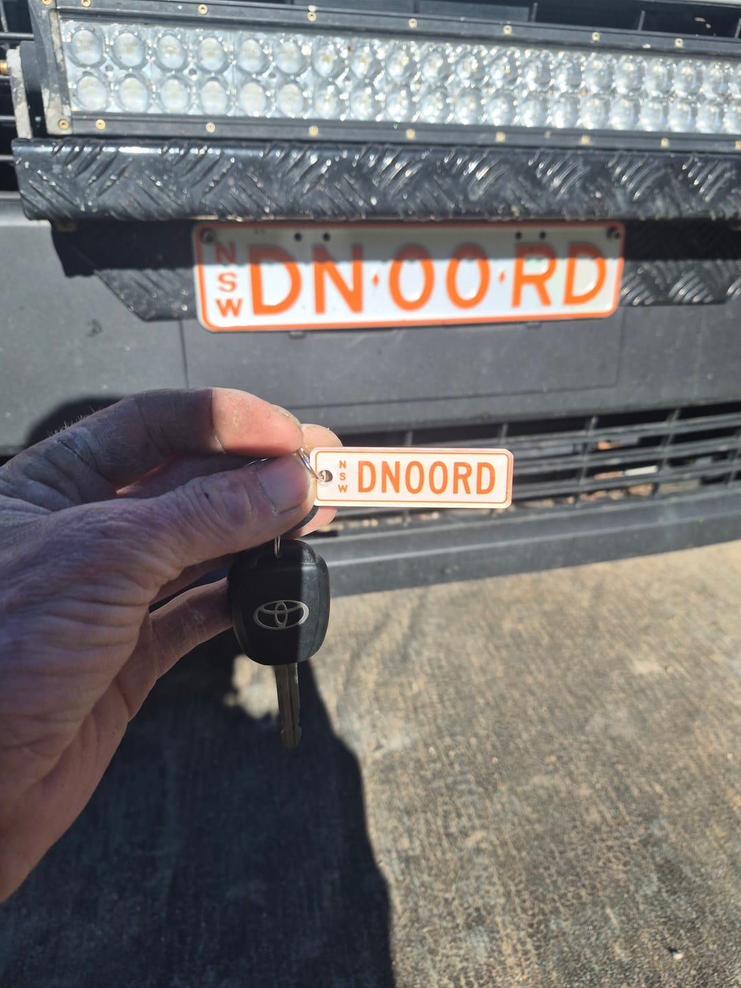 Customer photo review of NSW Colour on Black Licence Plate Custom Keychain