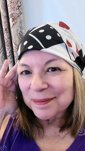 Customer's Gamble Bandana featuring black and white game motif worn on head.