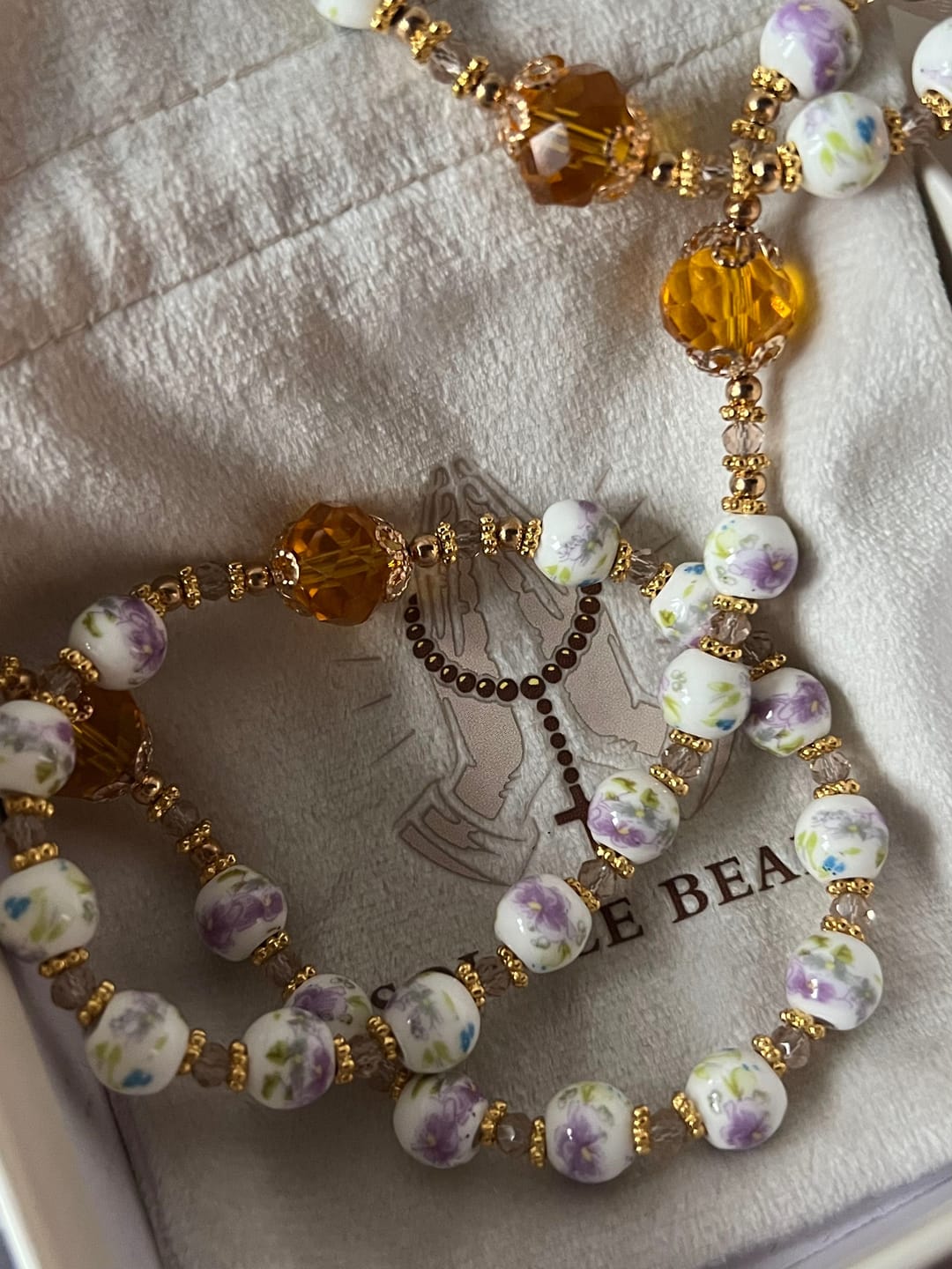 Customer photo review of SolaceBeads Lavender Floral With Golden Sacred Heart & Crucifix Rosary: Faith in Every Bead