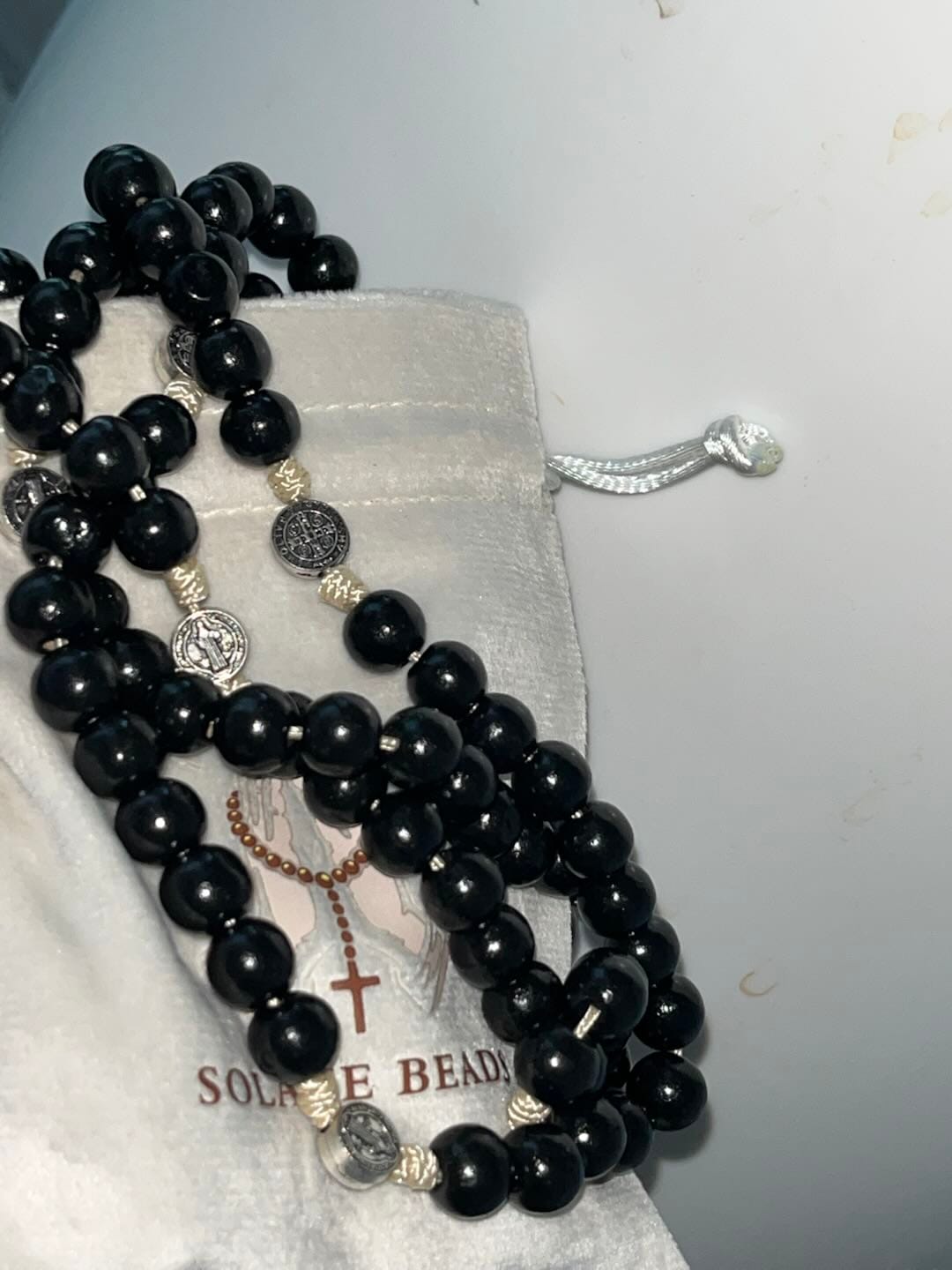 Customer photo review of SolaceBeads 15/20 Decade Ebony Wood Rosary With St. Benedict Medals & Crucifix: Protective Strength
