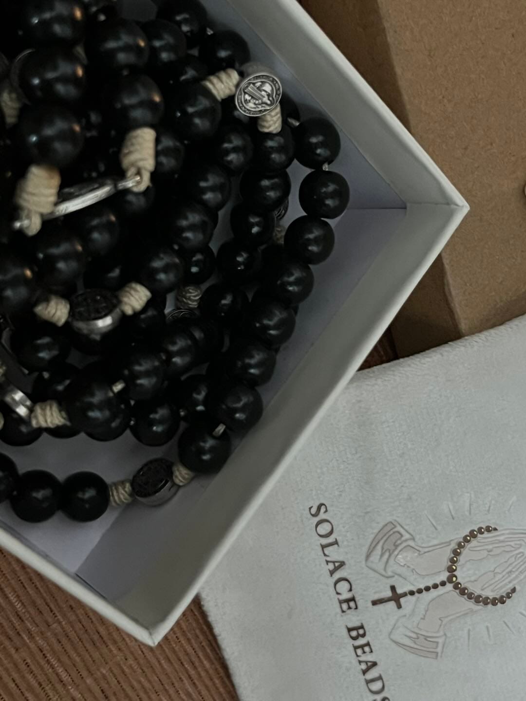 Customer photo review of SolaceBeads 15/20 Decade Ebony Wood Rosary With St. Benedict Medals & Crucifix: Protective Strength