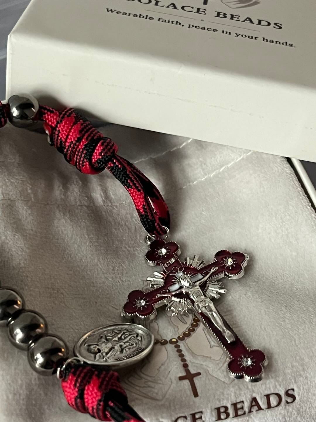 Customer photo review of Solacebeads Gunmetal Bead Car Rosary & Red Enamel Crucifix: Rooted In St. Michael Protection