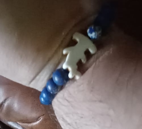 Customer's Shark Week Bracelet with blue beads and a white hammerhead shark charm worn on a wrist.