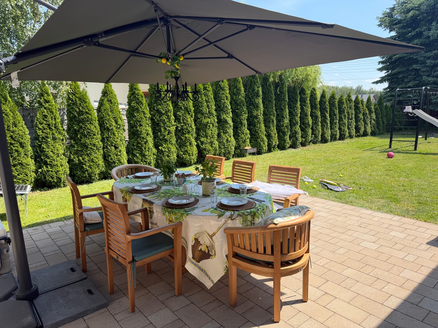 Customer photo review of Teak Set 180-240cm Oval Extendable Table 4cm top and 120cm Wide with 6 Oxford stacking chairs & 2 San Francisco chairs, Free Cushions