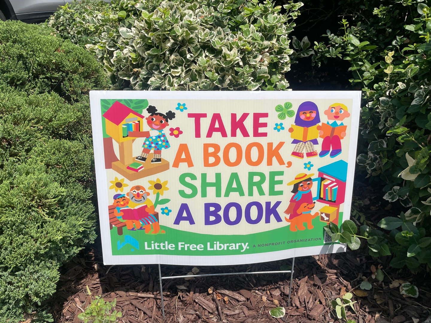 Customer photo review of Take a Book Share a Book Yard Sign
