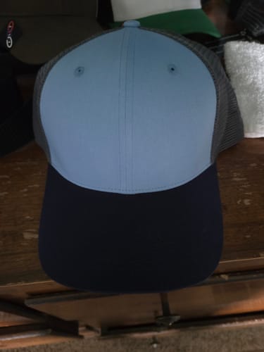 Customer's Big Trucker Hat showing a light blue crown and dark navy brim.