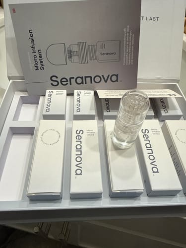 Customer's Seranova Micro Infusion System kit unboxed, showing multiple devices in their packaging and the instruction manual.