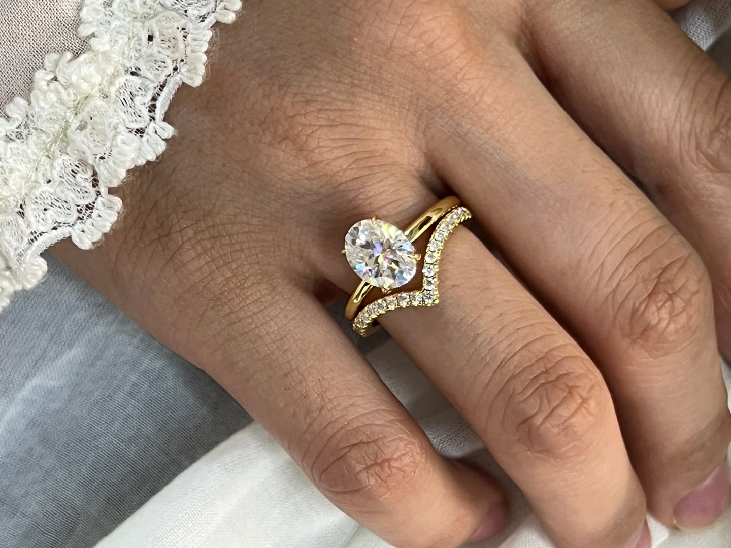 Customer photo review of S925 Moissanite 2Ct Oval Cut Solitaire V Shape Pave Nest Two Piece 18K Yellow Gold Plated Bridal Ring Set