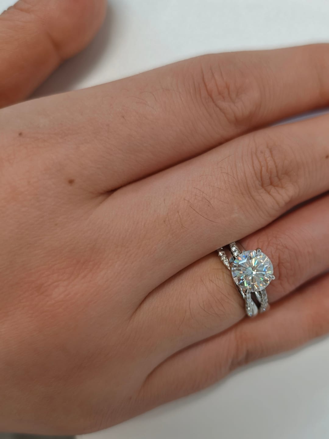 Customer photo review of S925 Moissanite 2.0 Carat Round Cut Twist Wedding Ring Set For Everyday Wear
