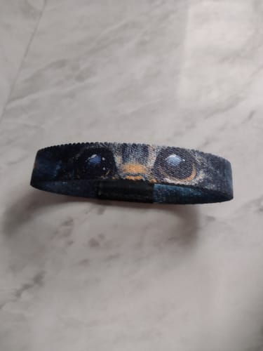 Customer's Stay Curious Cat Bracelet laid flat, showing the detailed cat's eye design.