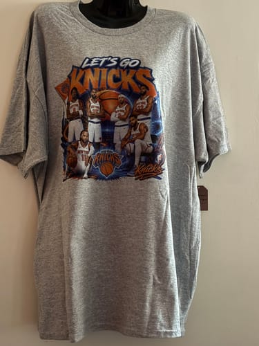 Customer's grey t-shirt with a custom 'Let's Go Knicks' graphic, created using the DTF printing guide.