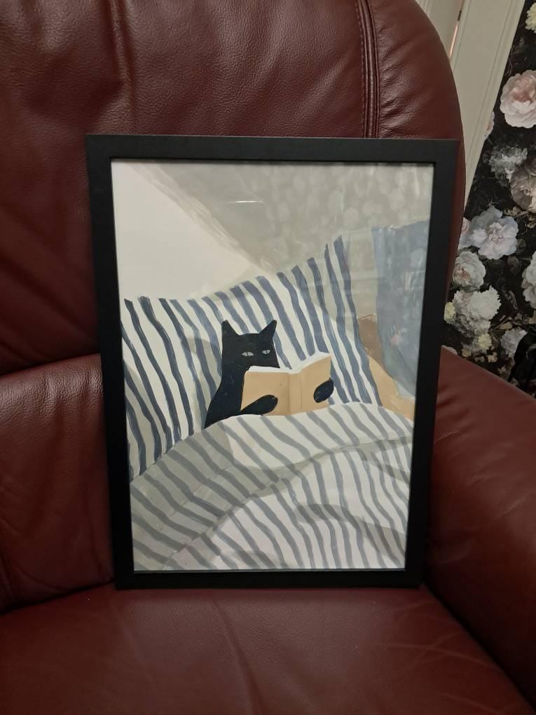 Customer photo review of Black Cat Reading in Bed Canvas Wall Art – Cozy Book Lover Print