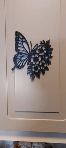 Customer's intricate black cutout of a butterfly and flowers made with the AtomStack A20 Pro V2.