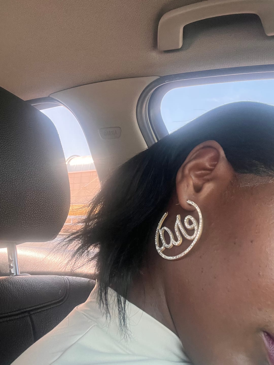 Customer photo review of Gold Luxe Logo Hoops