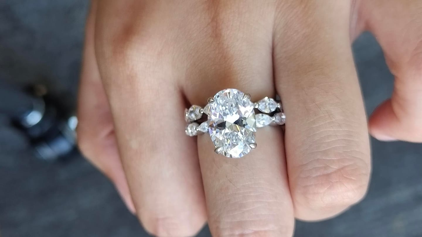 Customer photo review of S925 2PC Wedding Ring Set 4.5Ct Oval Cut Engagement Ring With Marquise Cut Full Wedding Band