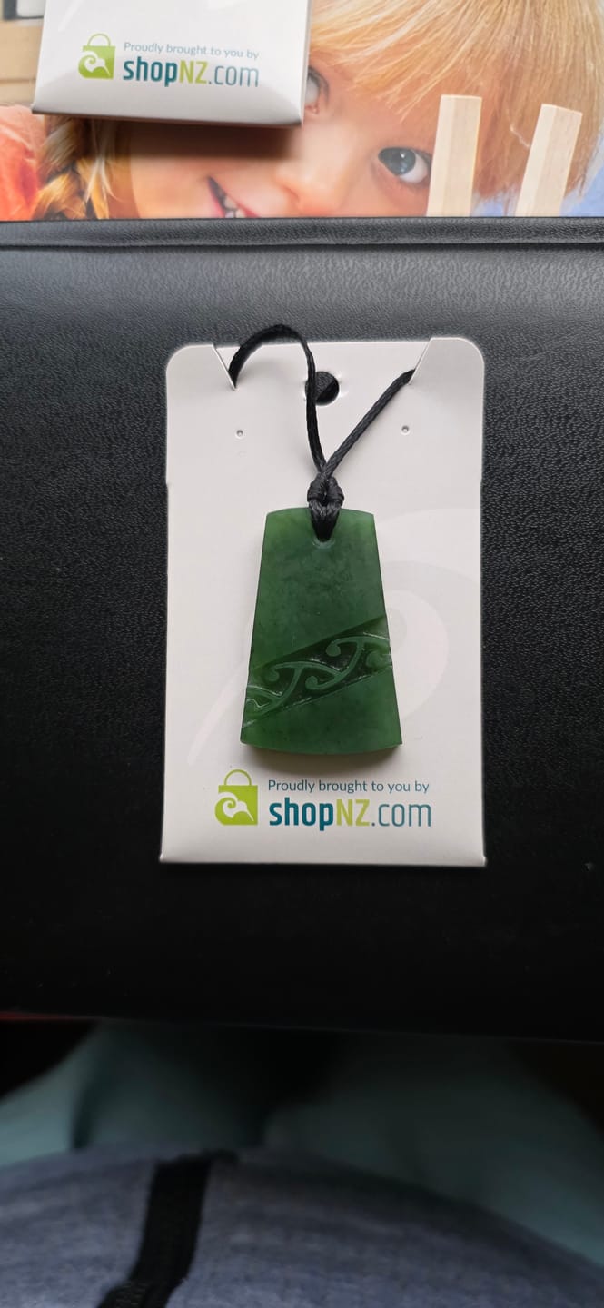 Customer photo review of Genuine NZ Greenstone Toki Necklace with Kowhaiwhai Carving