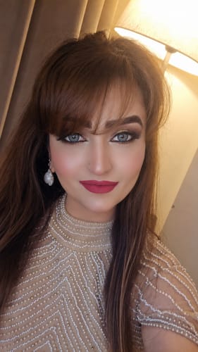Reviewer in a close-up showing the vibrant blue color of the Russian Velvet Tatiana Blue contact lenses.