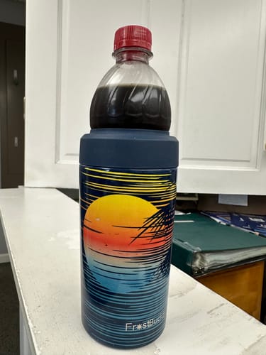 Customer's Universal Buddy cooler with a matching blue Replacement Silicone Lid, holding a plastic bottle.
