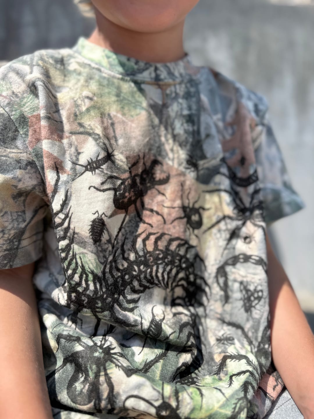 Customer photo review of Kids Camo Bug Oversized Tee