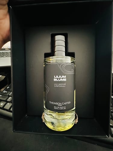 Customer's Lilium Blume Eau de Parfum bottle presented in its elegant black box.