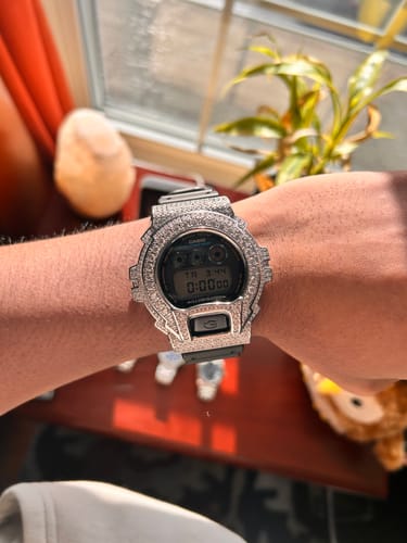 A customer's wrist showcasing the sparkling, stone-covered Rhodium Big Stone G-Shock watch.