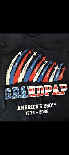 Customer's personalized black t-shirt with 'Grandpap' and the names of 12 grandchildren printed in patriotic jet trails.