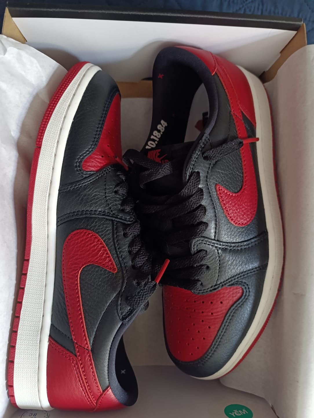 Customer photo review of Air Jordan 1 Retro Low OG "Banned" Black and Varsity Red