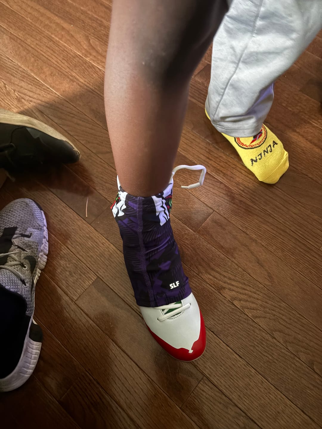 Customer photo review of The Officially Licensed Joker Youth Football Cleats - Velocity 2.0 by Phenom Elite