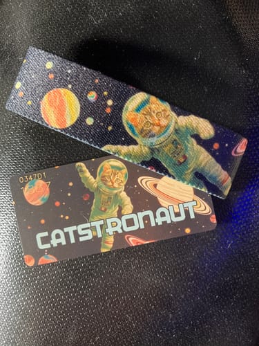 Customer's 'Catstronaut' wristband and matching collector card from the Beyond The Stars collection.