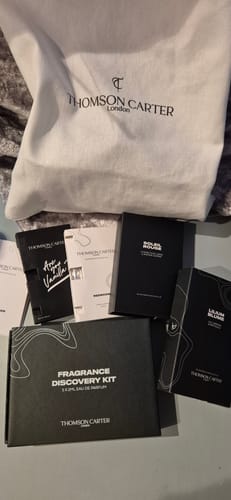 Reviewer's Lilium Blume perfume box shown with a discovery kit and other fragrances from the collection.