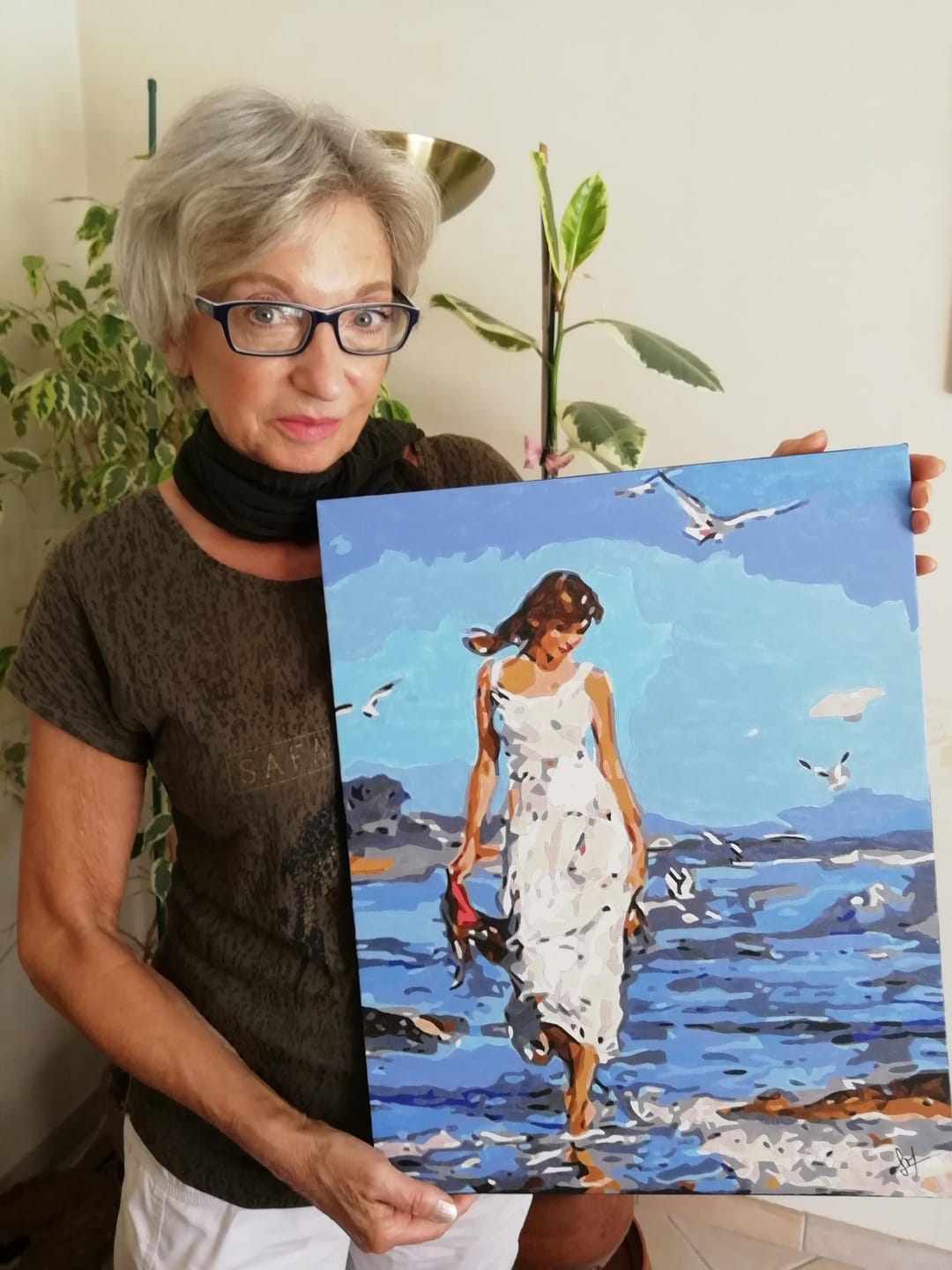 Customer photo review of Femme marchant au bord de Mer