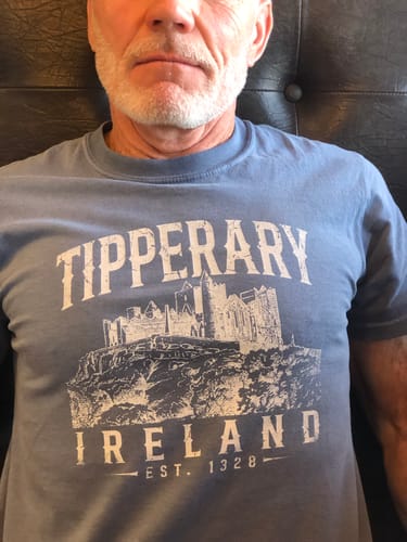 Customer wearing the blue Tipperary Ireland Vintage T-Shirt, showing the front castle graphic.