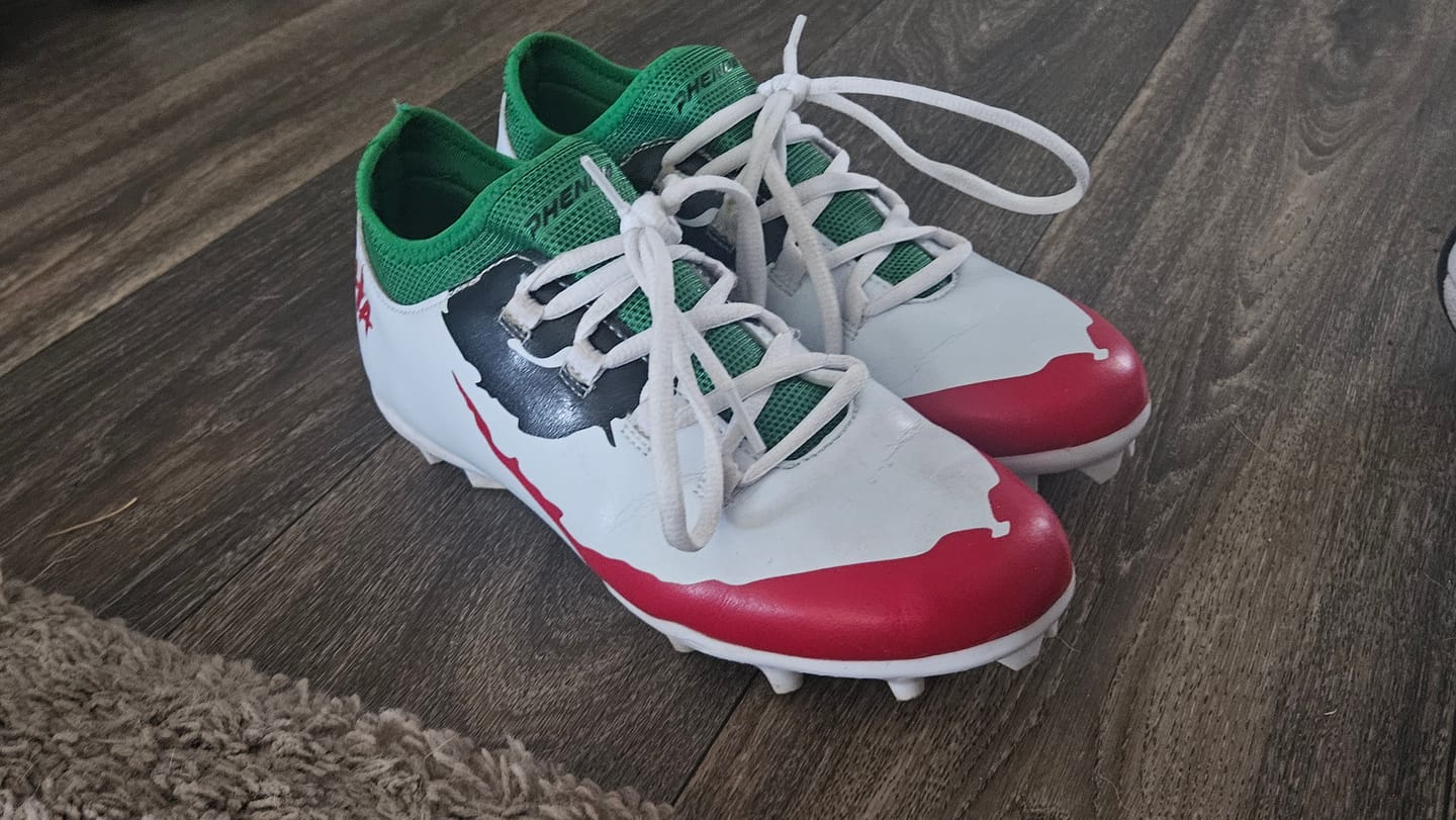 Customer photo review of The Officially Licensed Joker Youth Football Cleats - Velocity 2.0 by Phenom Elite